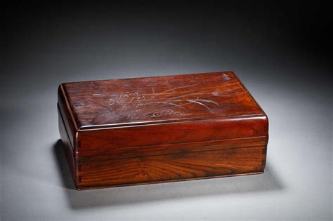 At Auction: A CHINESE HUANGHUALI WOOD COVERED BOX