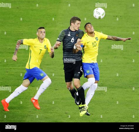Neymar (R) and Sven Bender (C) vie for the ball in the second half of ...