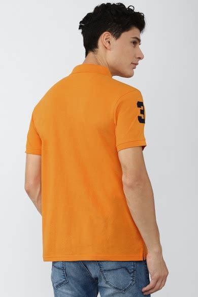 Peter England Casuals Polo T-Shirts, Men Orange Solid Polo Neck Polo T ...