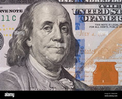 Benjamin Franklin portrait on one hundred dollar bill closeup macro ...
