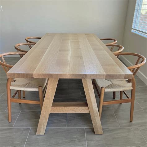 Elegant White Dining Table with Oak Legs for Modern Homes