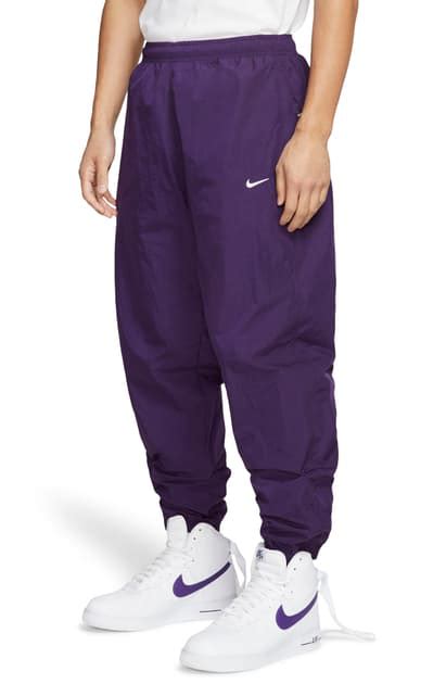 nike purple track pants