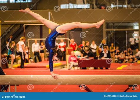 Young Gymnast Girl Performing Routine on Balance B Stock Photo - Image ...