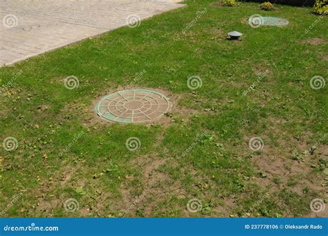 Two Manhole Covers on the Green Lawn of a Septic Tank System, Sewer ...