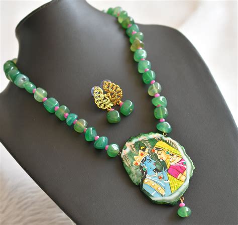 Hand painted radha-krishna sliced agate pendant with green-pink onyx b ...