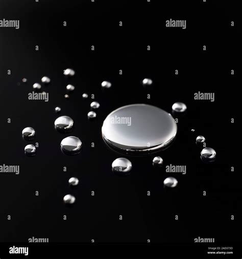 Drops of mercury. Mercury is a heavy, silvery metal that is liquid at ...