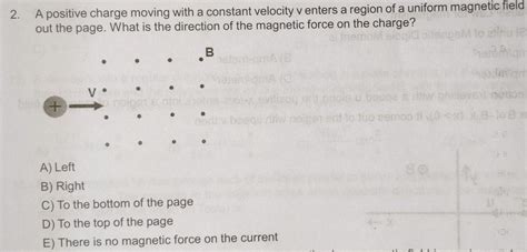 2.A positive charge moving with a constant velocity v enters a region ...