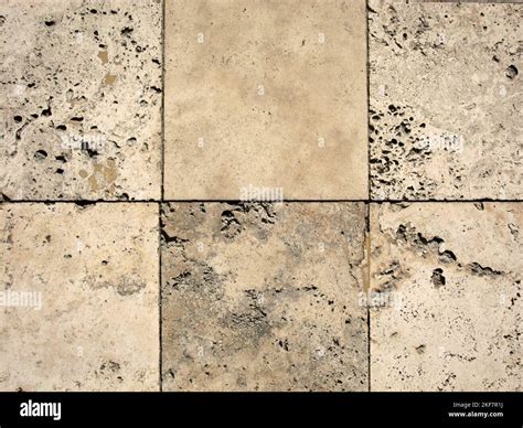 Travertine tiles fit together in outdoor flooring Stock Photo - Alamy
