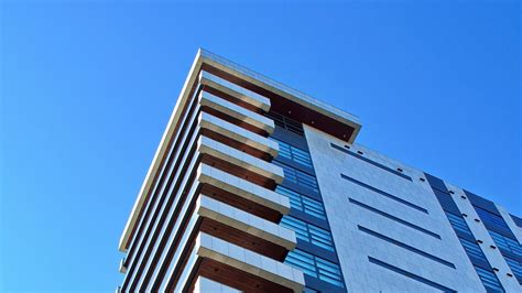 Download wallpaper 1366x768 building, faces, balconies, architecture ...