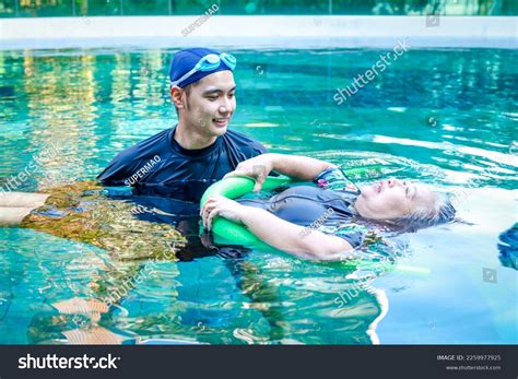 Asian Man Physiotherapist Helping Elderly Female Stock Photo 2259977925 ...