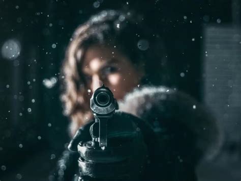 Armed Woman Kills Gunman