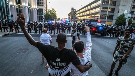 People gather at Breonna Taylors make shift memorial in Injustice Square Park in downtown Louisville