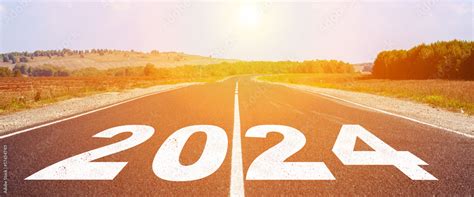 2024 written on highway road in the middle of empty asphalt road and ...