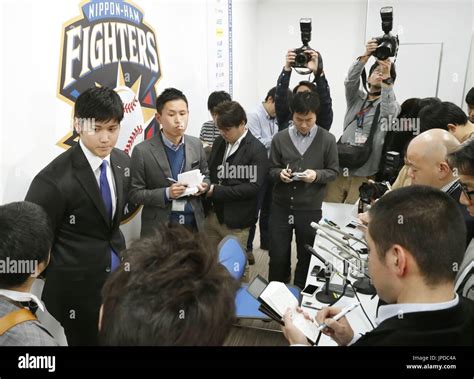 Nippon Ham Fighters pitcher-designated hitter Shohei Otani (2nd from L ...