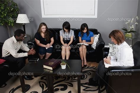 Group of People Standing in a Room Talking 的图像结果