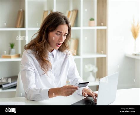 payments problem scared woman online balance Stock Photo - Alamy