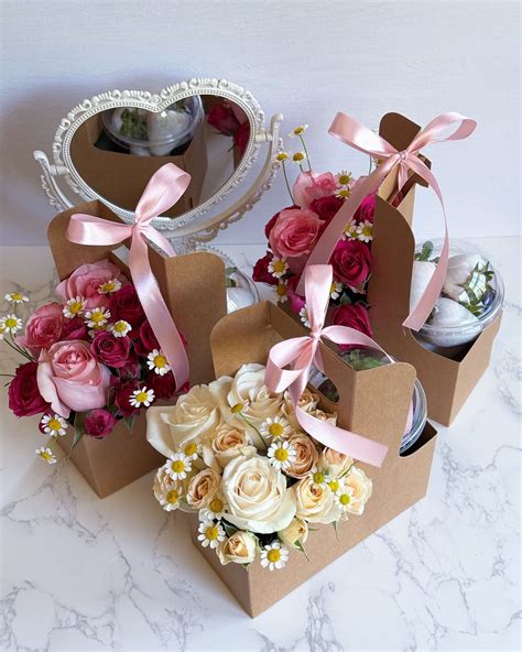 Floral cup holder with flowers and some chocolate covered strawberries ...
