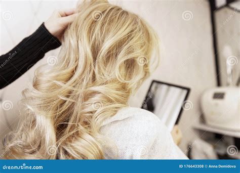 Blonde Girl in a Beauty Salon Doing a Hairstyle. Close-up Stock Photo ...