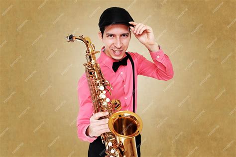 Premium Photo | White male saxophonist wearing pink long sleeves shirt ...