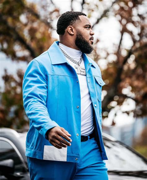 Download Stylish Manin Blue Outfit Wallpaper | Wallpapers.com