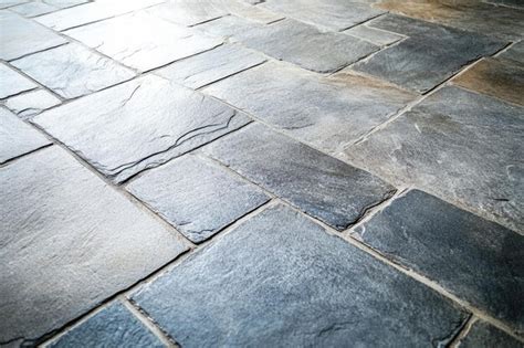 Stylish aged concrete flooring with textured stone tiles and modern ...