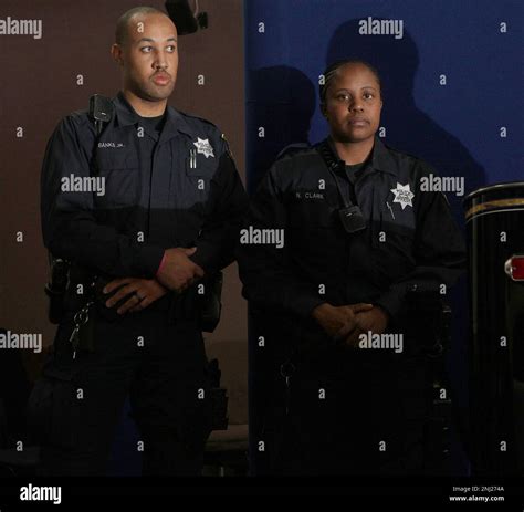 Oakland police officers Anthony Banks, Jr. (left) , and Nadia Clark ...