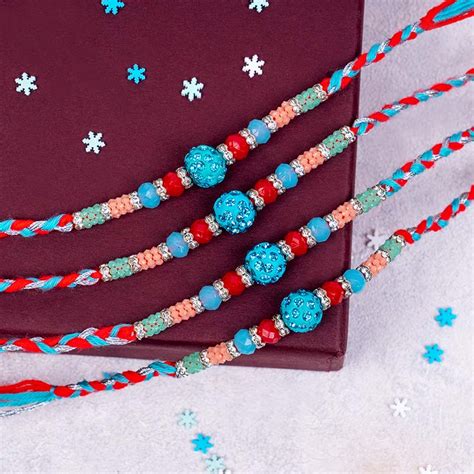 Send Four Fancy Rakhi Set with Roli Chawal Online | Rakhibazaar.com