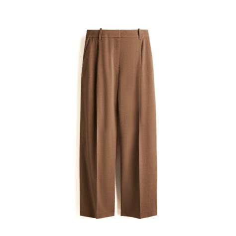 Brown trousers are a stylish alternative to jeans this season | Vogue India