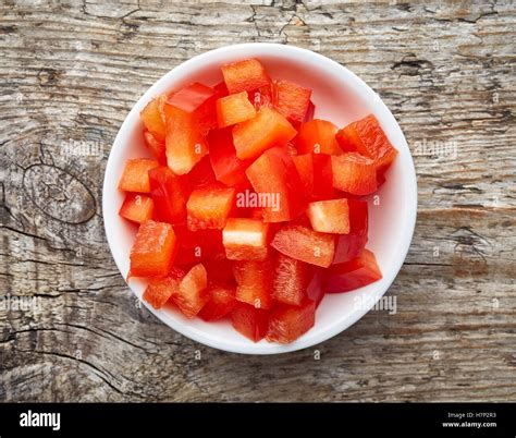 Bowl of chopped bell pepper isolated on white background, top view ...