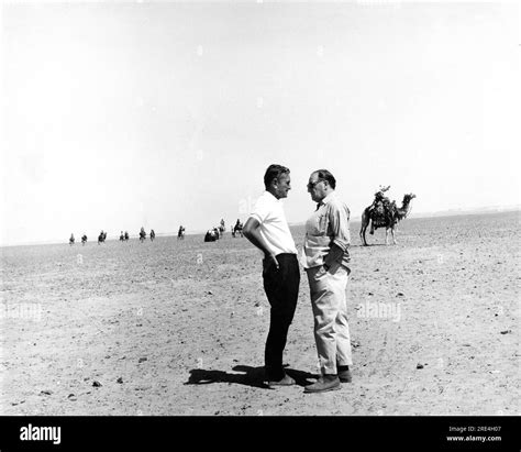 Director DAVID LEAN and Producer SAM SPIEGEL on set location candid during filming of LAWRENCE ...