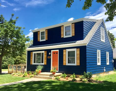 Navy House with White Trim and Cedar Shutters