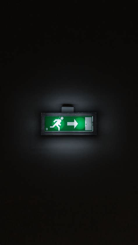 Download wallpaper 938x1668 exit, pointer, sign, backlight, dark iphone ...
