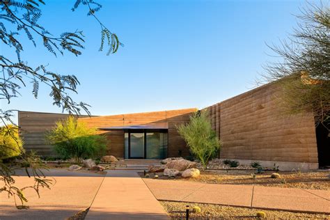 Photo 2 of 14 in A Dramatic Floating Roof Crowns This Rammed Earth Home ...