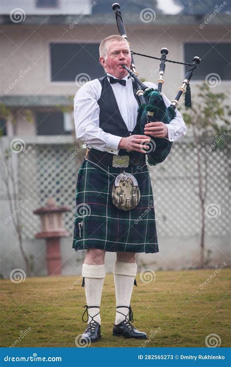 Scottish Piper from Scotland in Traditional Outfit with Tartan Kilt ...