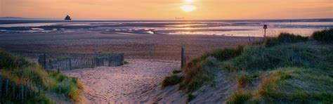Download wallpaper coast, sunrise, Through the dunes, Haile Sand Fort ...