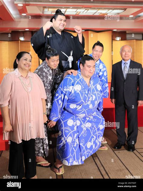 Sumo wrestler Takayasu (top ), riding his fellow sholders, with his ...
