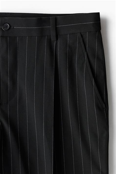 Men’s Black/Pinstriped Loose Fit Tailored trousers | H&M IN