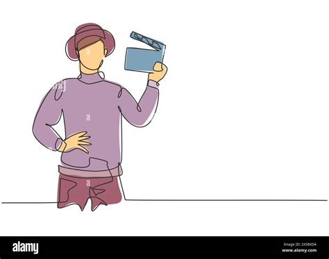 Single one line drawing of young smart male film director holding ...