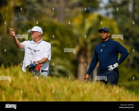 February 16, 2024 Tiger Woods and caddie Lance Bennett during the ...
