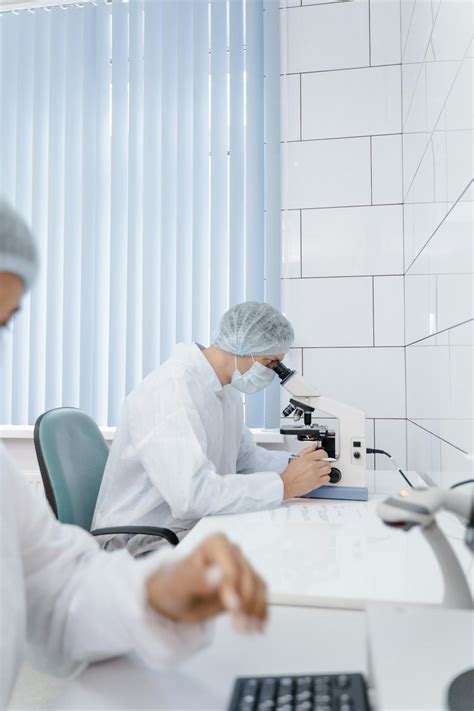 Image result for A Person Inspecting Using Microscope