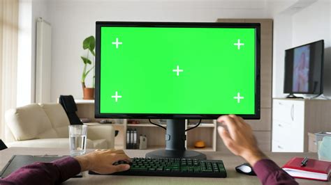 First person view man hands typing on computer keyboard with big green ...
