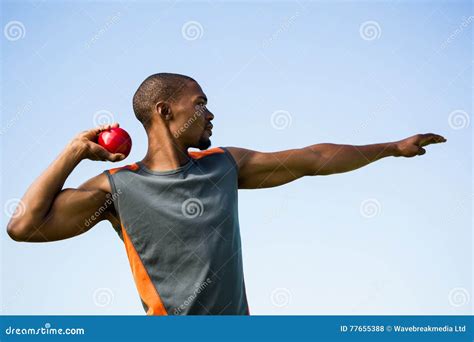 Athlete about To Throw Shot Put Ball Stock Photo - Image of sunny ...
