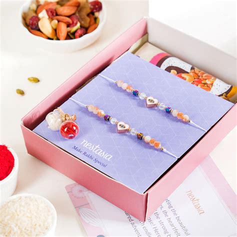 White Heart Hamsa Eye Amulet Rakhi Gift Box Online - Premium Gift ...