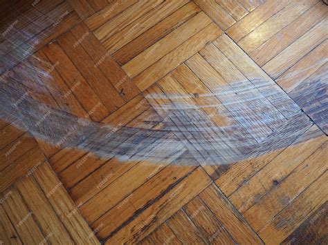 Premium Photo | Scratched parquet flooring in the room scratches chips ...