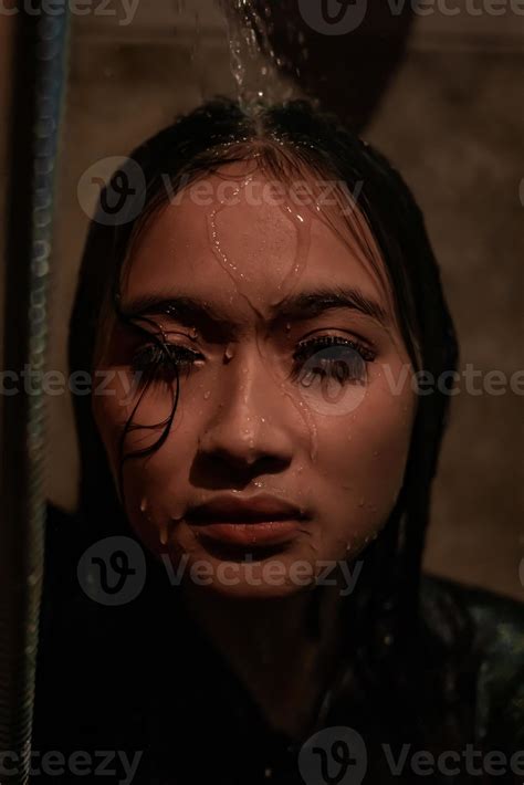 Depression girl covered with water while crying in the bathroom alone ...