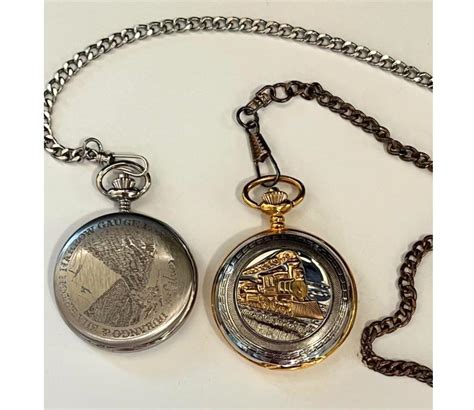 Two Flip Top Pocket Watches with Fobs | EstateSales.org