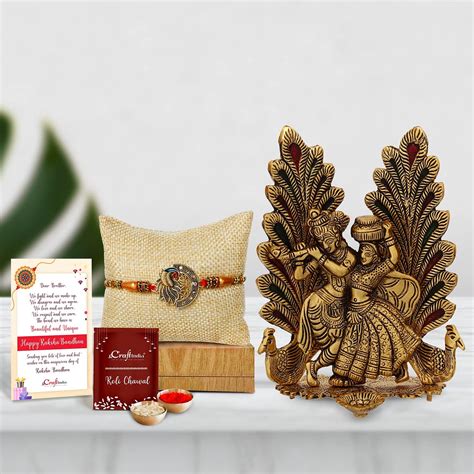 Buy eCraftIndia Beautiful Peacock Rakhi with Golden Radha Krishna Idol ...