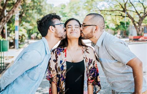 Premium Photo | Love triangle concept polygamy concept two men kissing ...