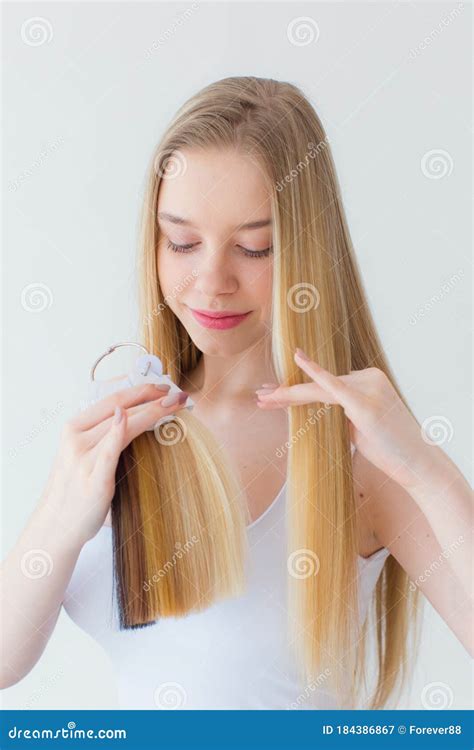 Shot of Young Girl Chooses Hair Color from a Tester of Hair Strands in ...