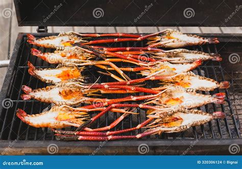 Grills King Prawns on Charcoal Grill in the Restaurant. Stock Photo ...